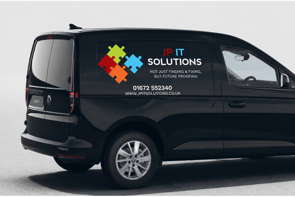 Black van with company logo, phone number and website to show onsite support