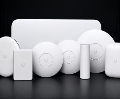 A collection of Ubiquiti products arranged neatly, highlighting their modern aesthetic and advanced networking features